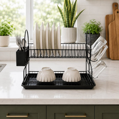 Dish rack with 360-degree swivel drainage spout draining into sink