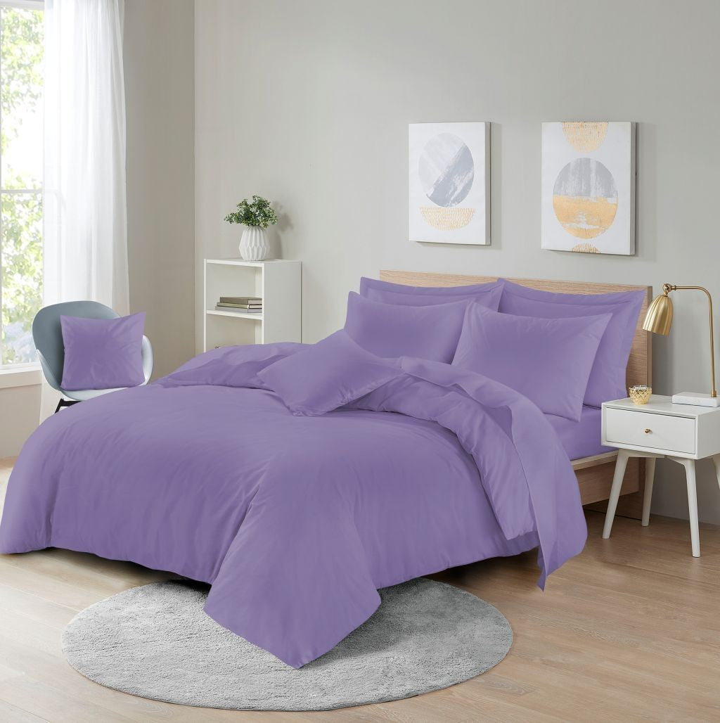 Navy microfibre quilt cover with matching pillowcases on king size bed