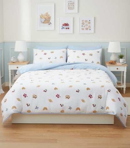 Cherry and Bow print duvet cover styled in a bright teen bedroom