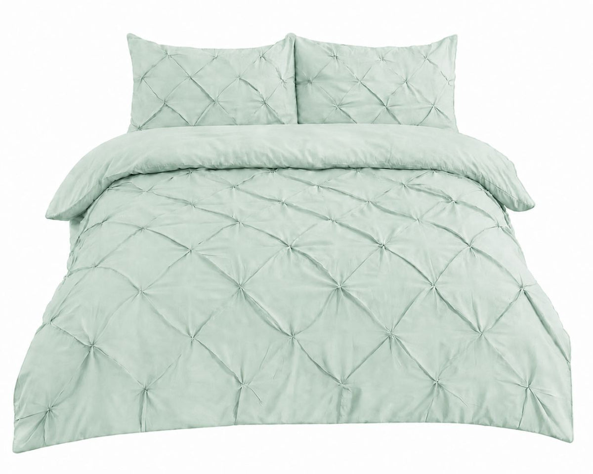 Cream pintuck pleated duvet set in a warm bedroom