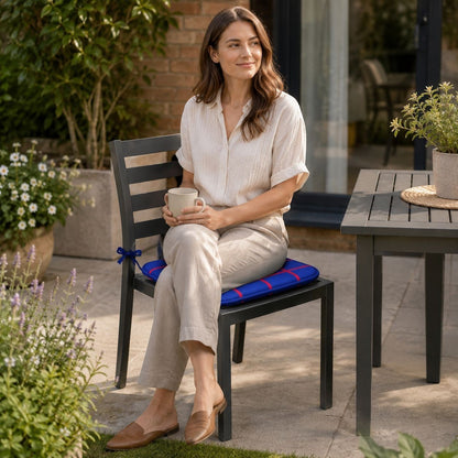 Check seat pads tied onto wooden dining chairs around a kitchen table