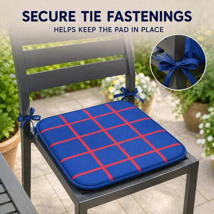 Long tie fastenings securing a seat pad to a dining chair