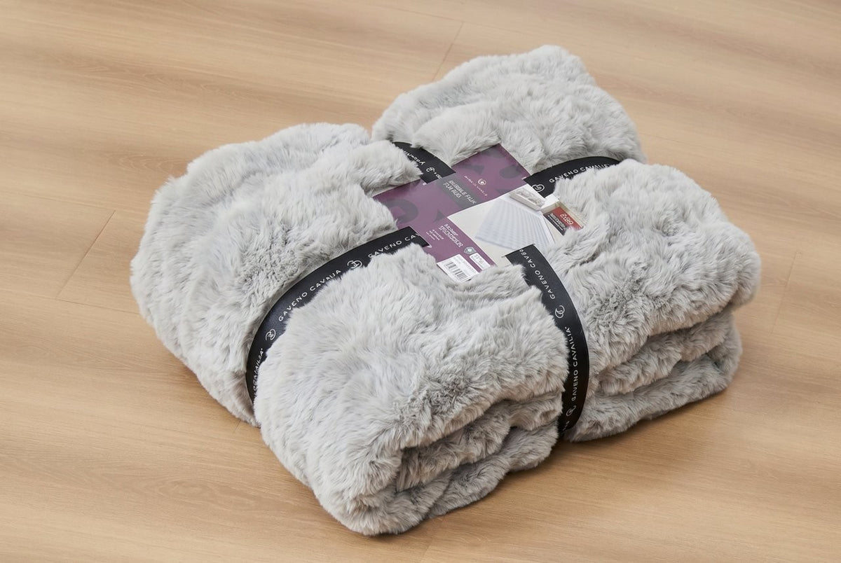 Colour range of faux rabbit fur rugs displayed together