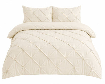 Cream pintuck pleated duvet cover in a warm neutral bedroom