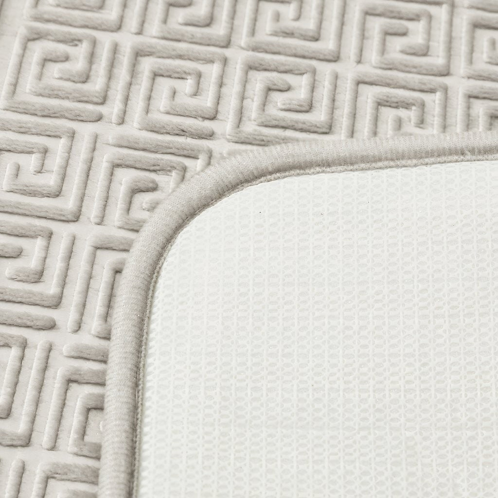 Pedestal toilet mat with U-shaped cut-out fitted around toilet base