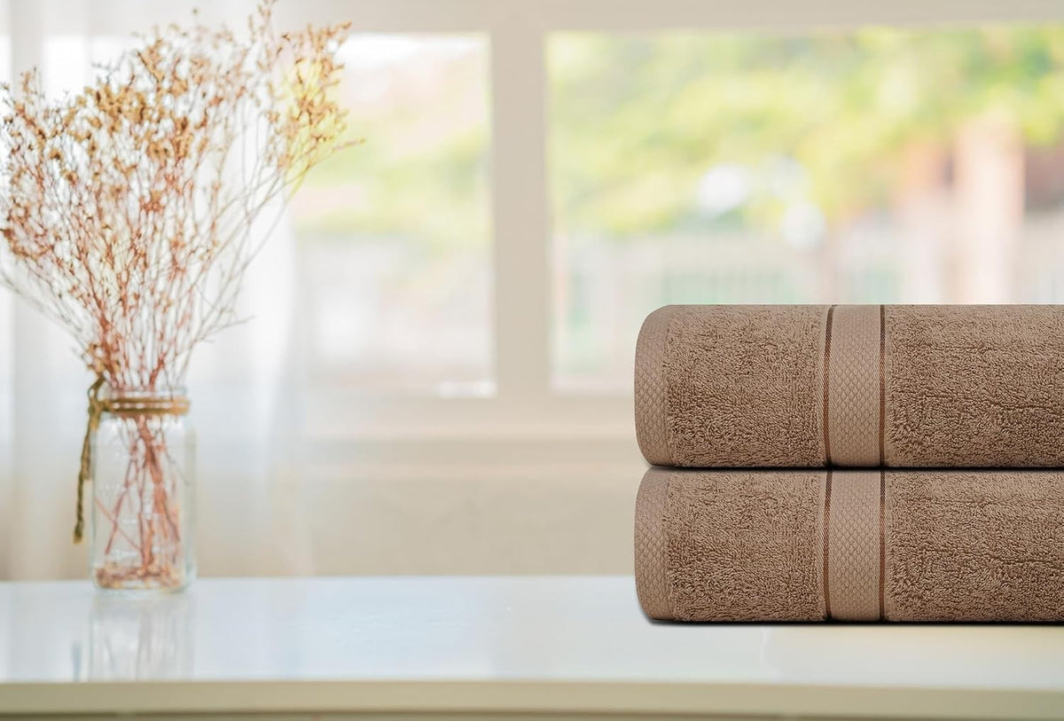 Cotton bath sheet size shown against a person for scale