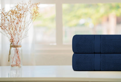Grey bath towel folded on a bathroom stool