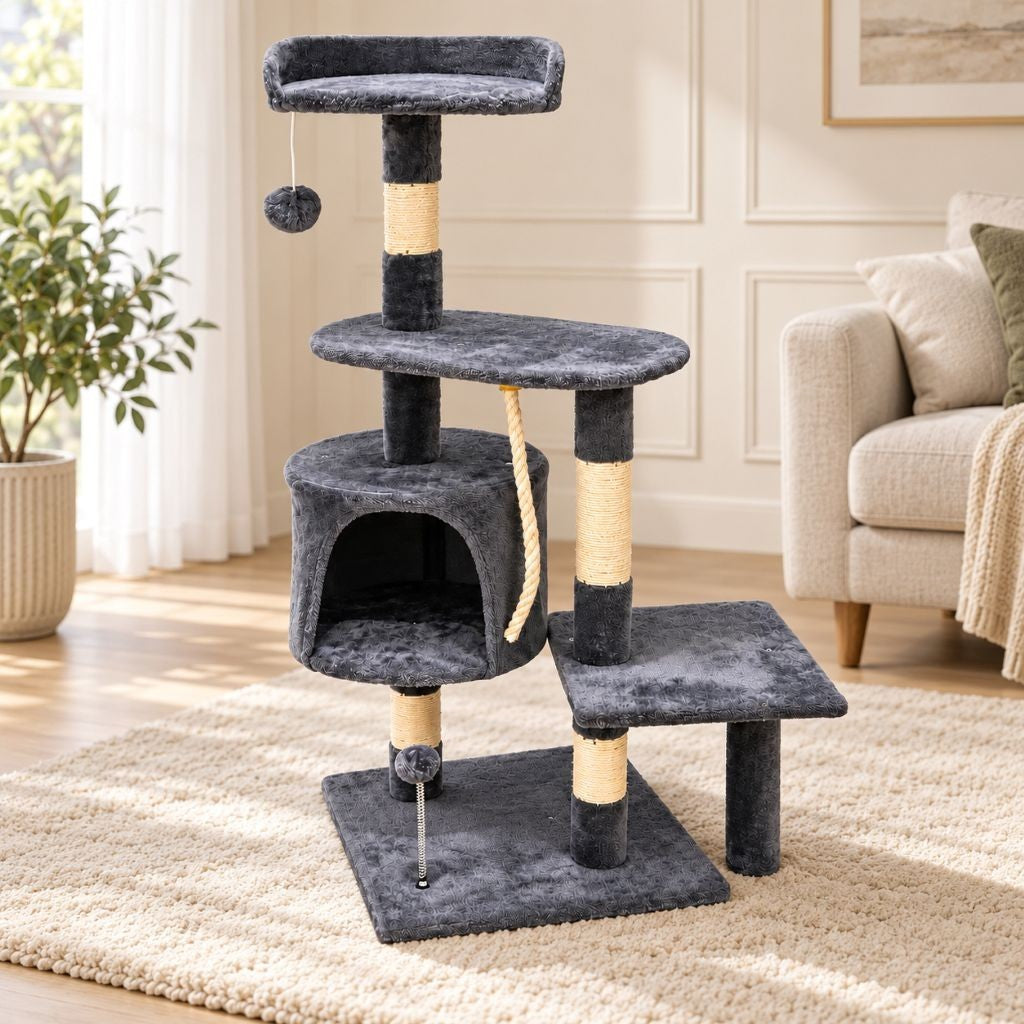 Cat climbing between plush platforms on the grey cat tree tower