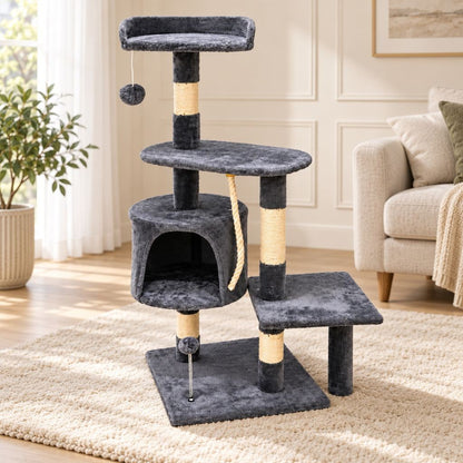 Cat climbing between plush platforms on the grey cat tree tower