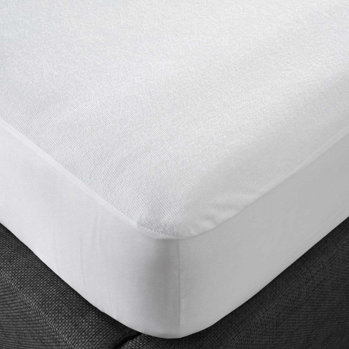 Deep pocket elasticated skirt fitting over a mattress