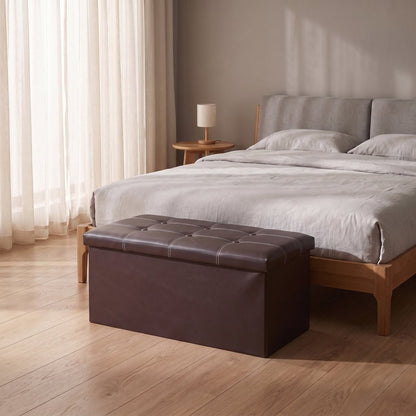 Close-up of button-tufted padded lid on faux leather storage ottoman