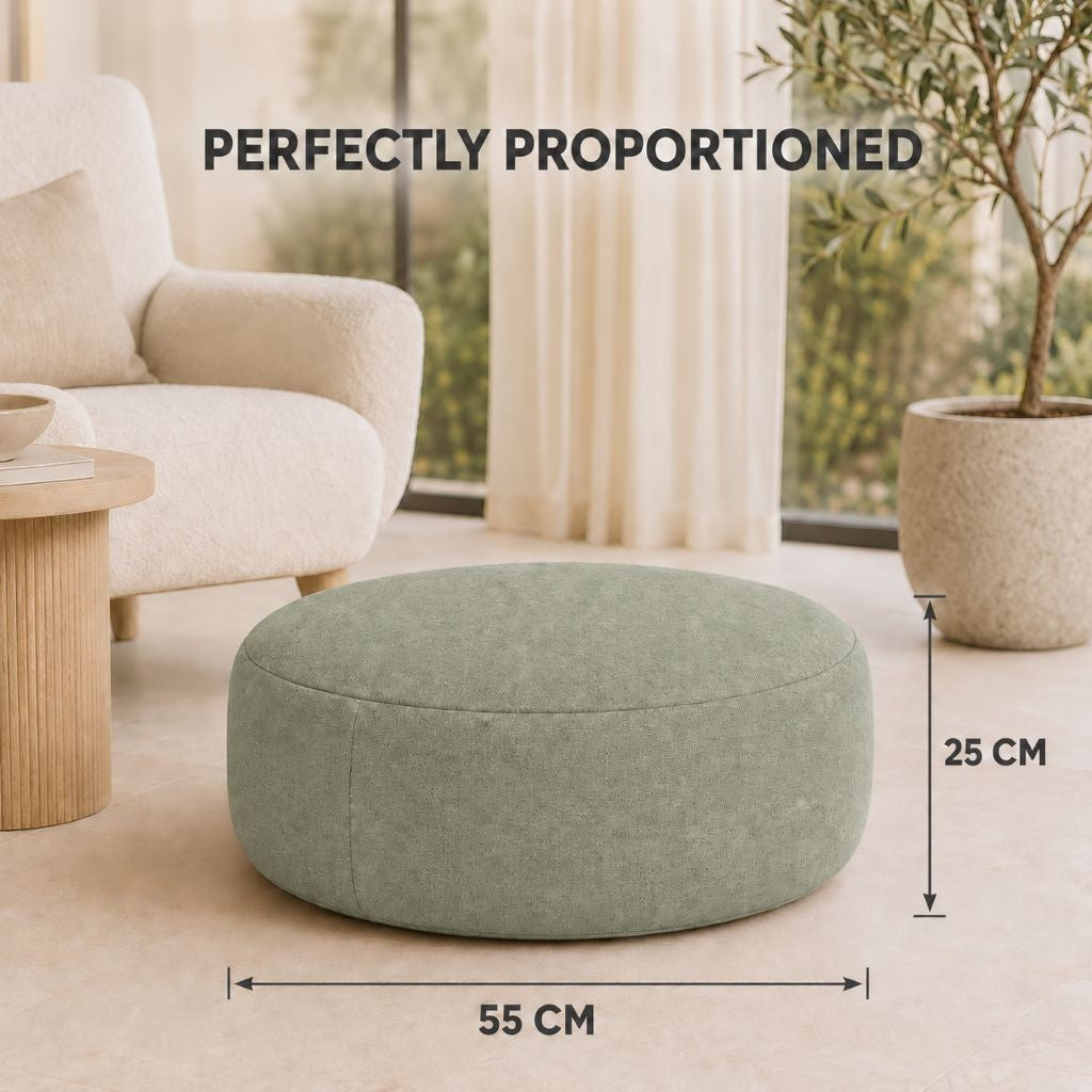 Beige square inflatable ottoman beside a rattan garden set