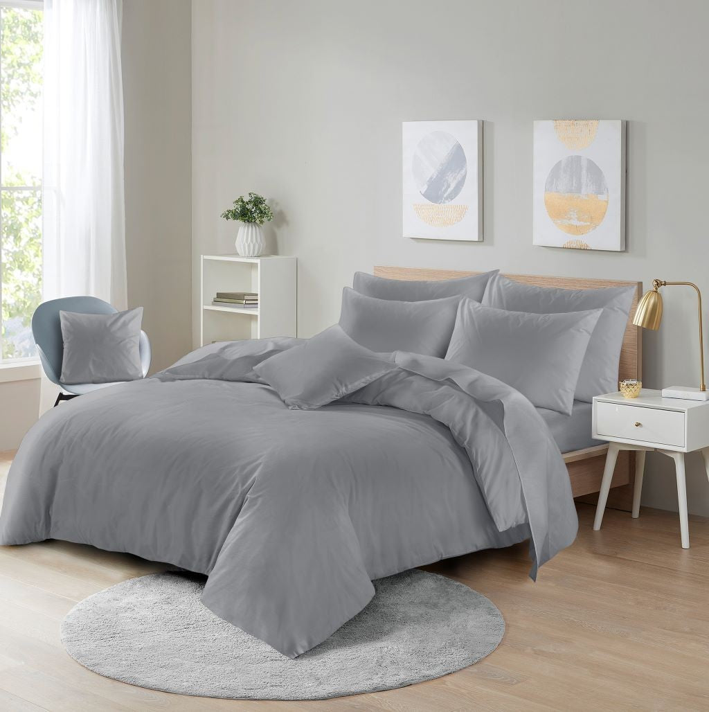 Crisp white microfibre bedding set on a double bed