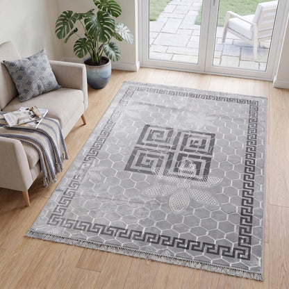 Burgundy Greek key rug adding warmth to a cosy lounge