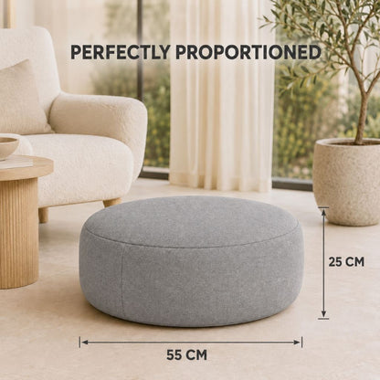 Green square inflatable pouffe on a lawn for summer gatherings