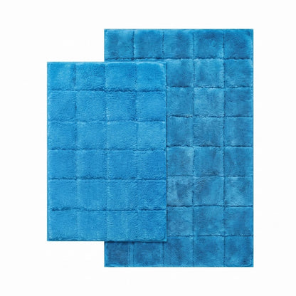 MaxWell ultra plush bath mat laid beside a bathtub