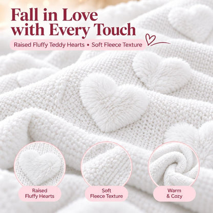 White teddy fleece heart throw folded on a bedroom armchair