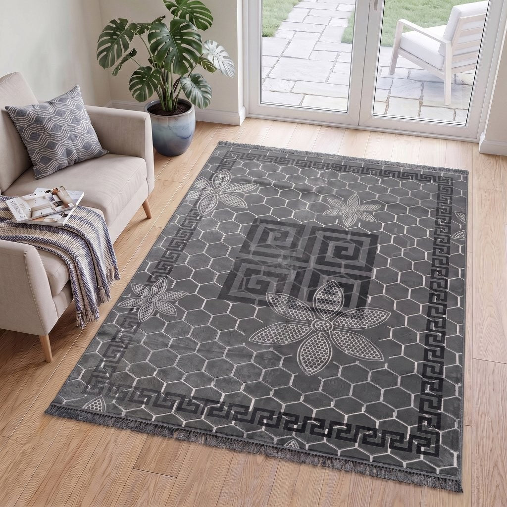 Grey Greek key rug shown in a neutral living room scheme