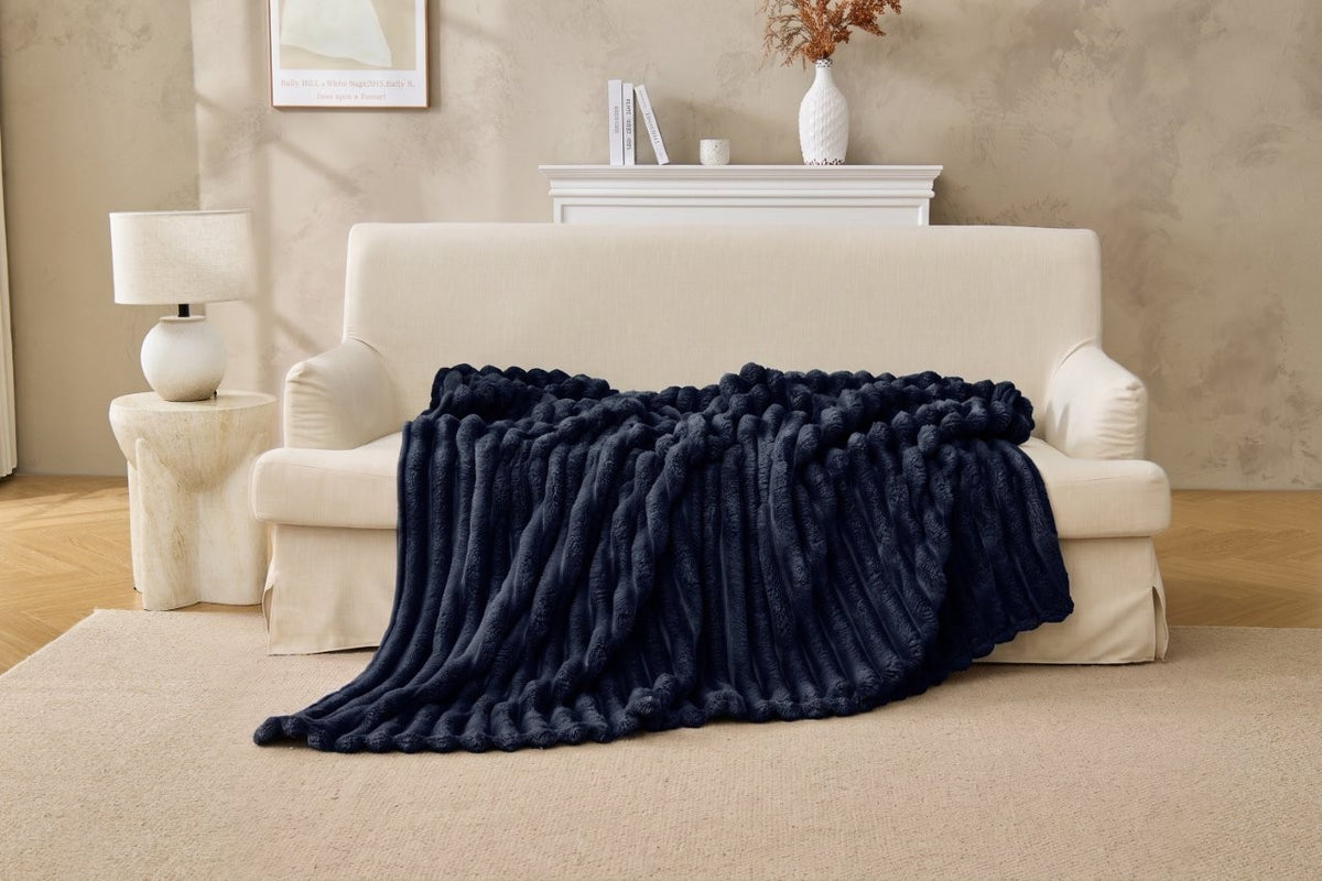 Lightweight fleece throw rolled up for travel and camping