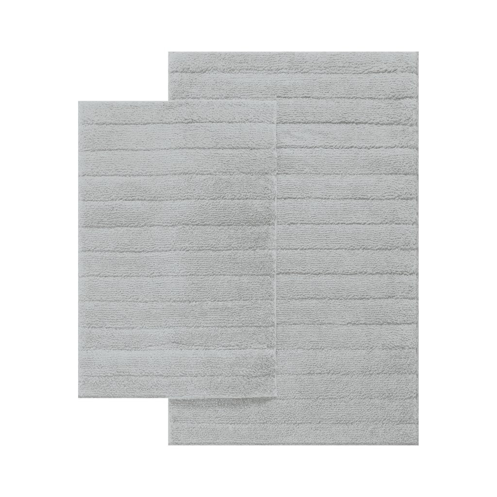 Cleo bath mat and pedestal mat styled together in a bright bathroom