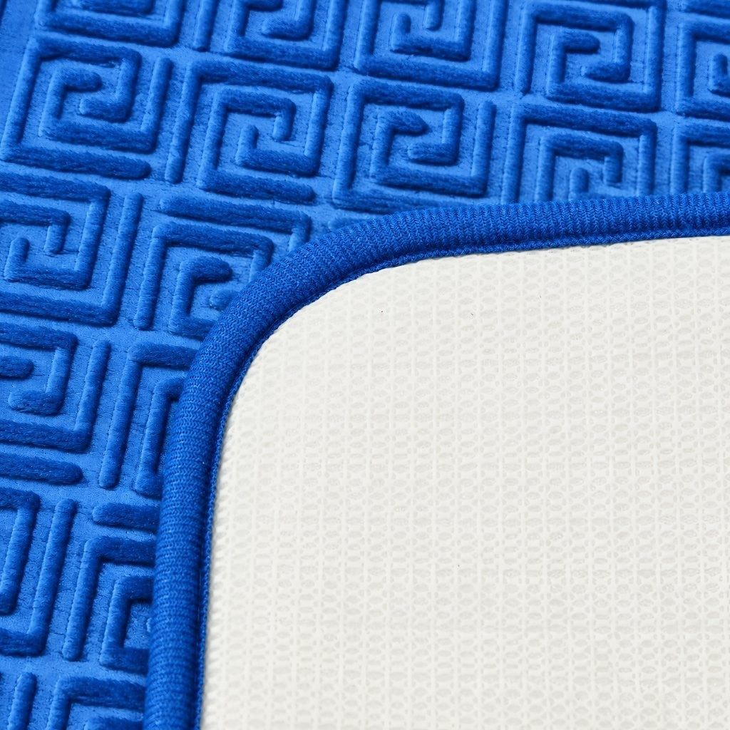 Cream contour toilet rug with classic Greek key edging