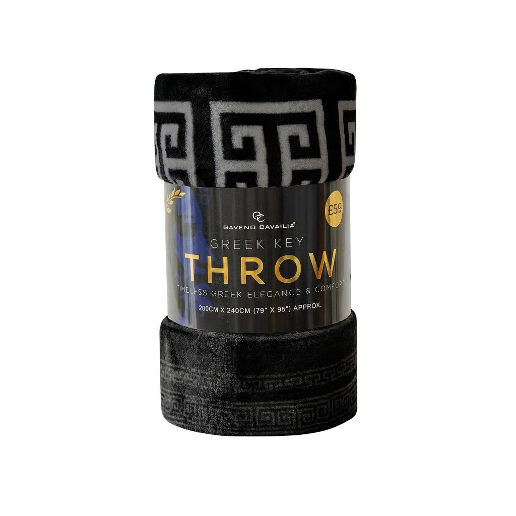 A folded black throw blanket with a gray Greek key pattern, wrapped in a paper band labeled 'Gavend Savailia Greek Key Throw'.