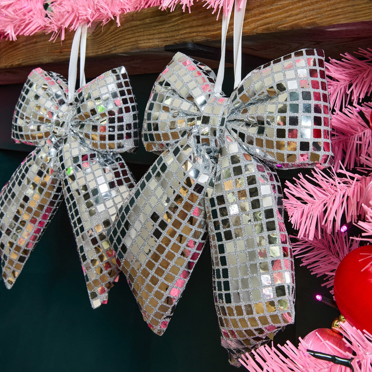 Silver disco ball bow styled on Christmas tree - party glam festive