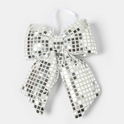 Disco ball silver Christmas bow hanging on tree branch