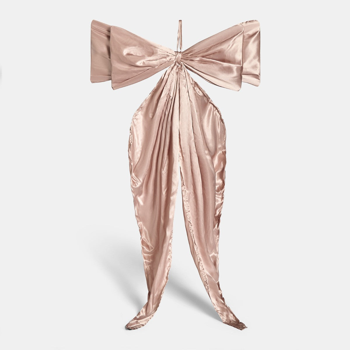 Natural Christmas bow close-up showing satin sheen and flowing tails