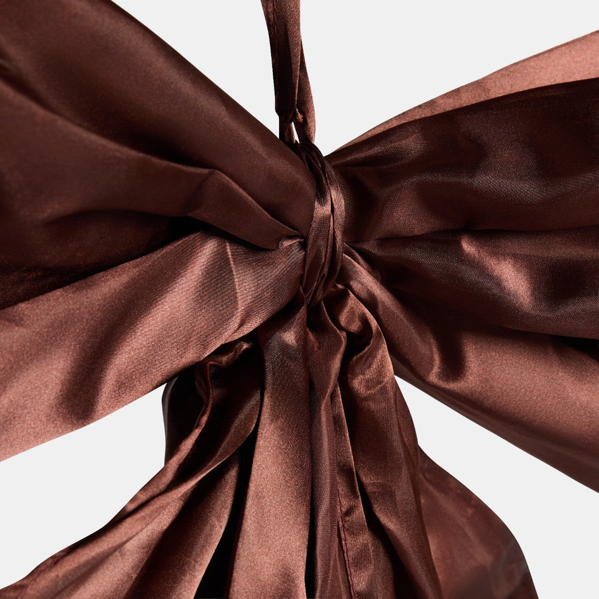Brown oversized bow as tree topper - classic Christmas styling