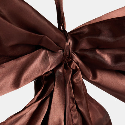 Brown oversized bow as tree topper - classic Christmas styling