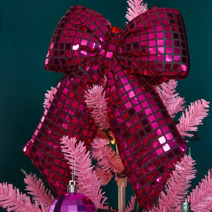 Pink disco ball bow styled on Christmas tree - Barbiecore festive