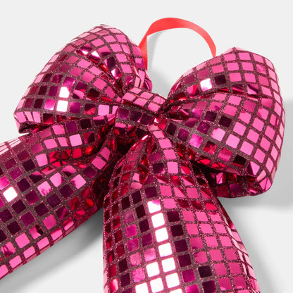 Pink mirrored bow on gift display - Pinkmas party decor