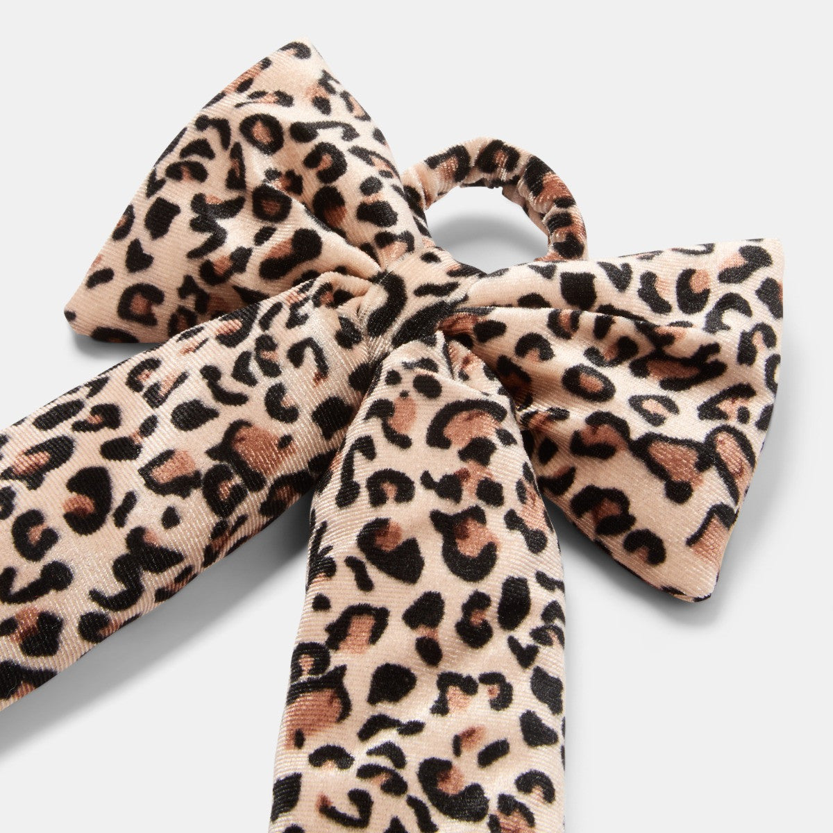 Leopard print Christmas bow on wreath - modern festive door decor