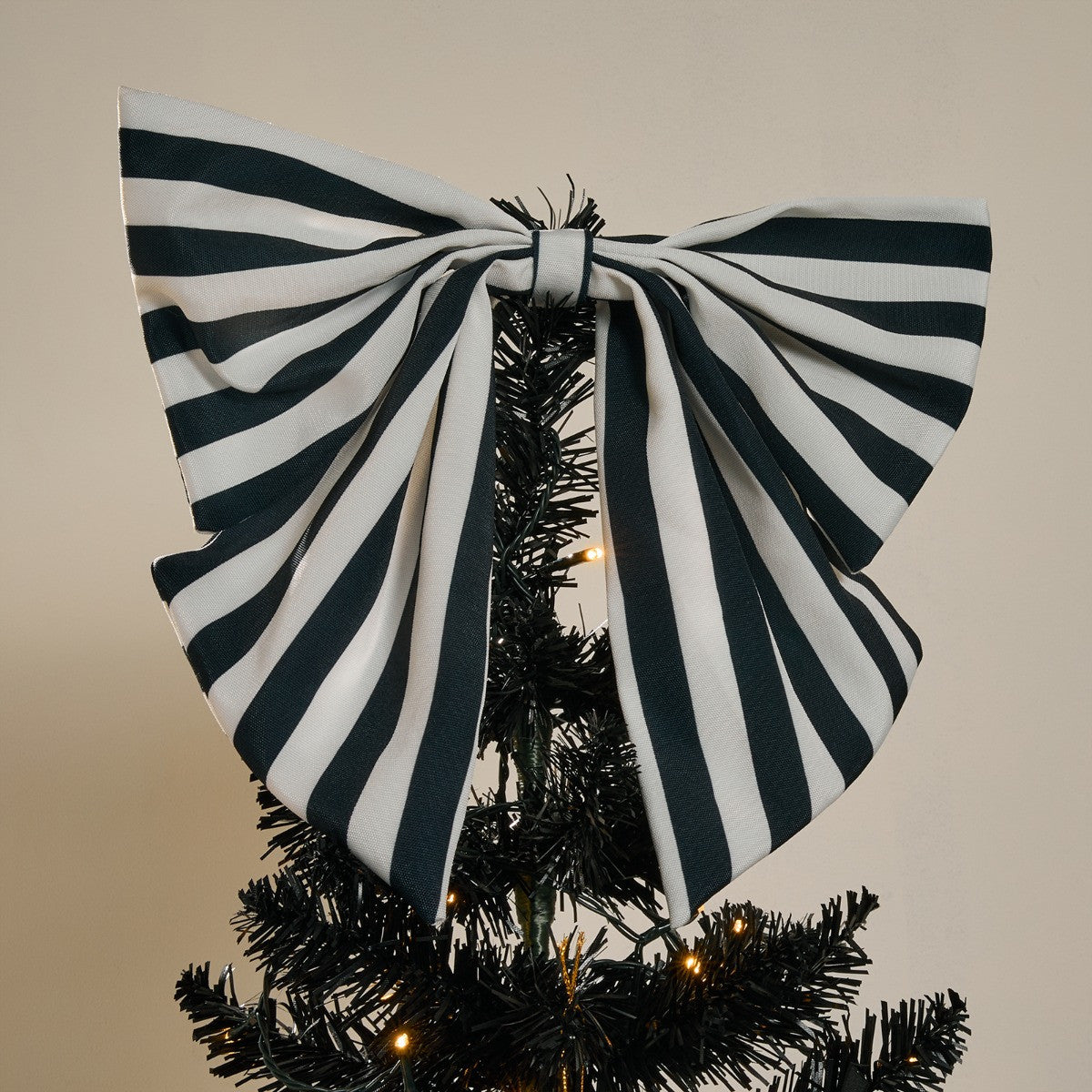 Modern monochrome Christmas tree with topper and matching bows