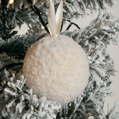 Neutral cream pom pom decorations close-up - Scandinavian Christmas