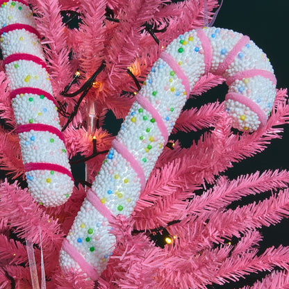 Candy cane hanging decorations styled on Christmas tree - sweet treat theme