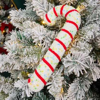 Traditional candy cane hanging decorations styled on Christmas tree