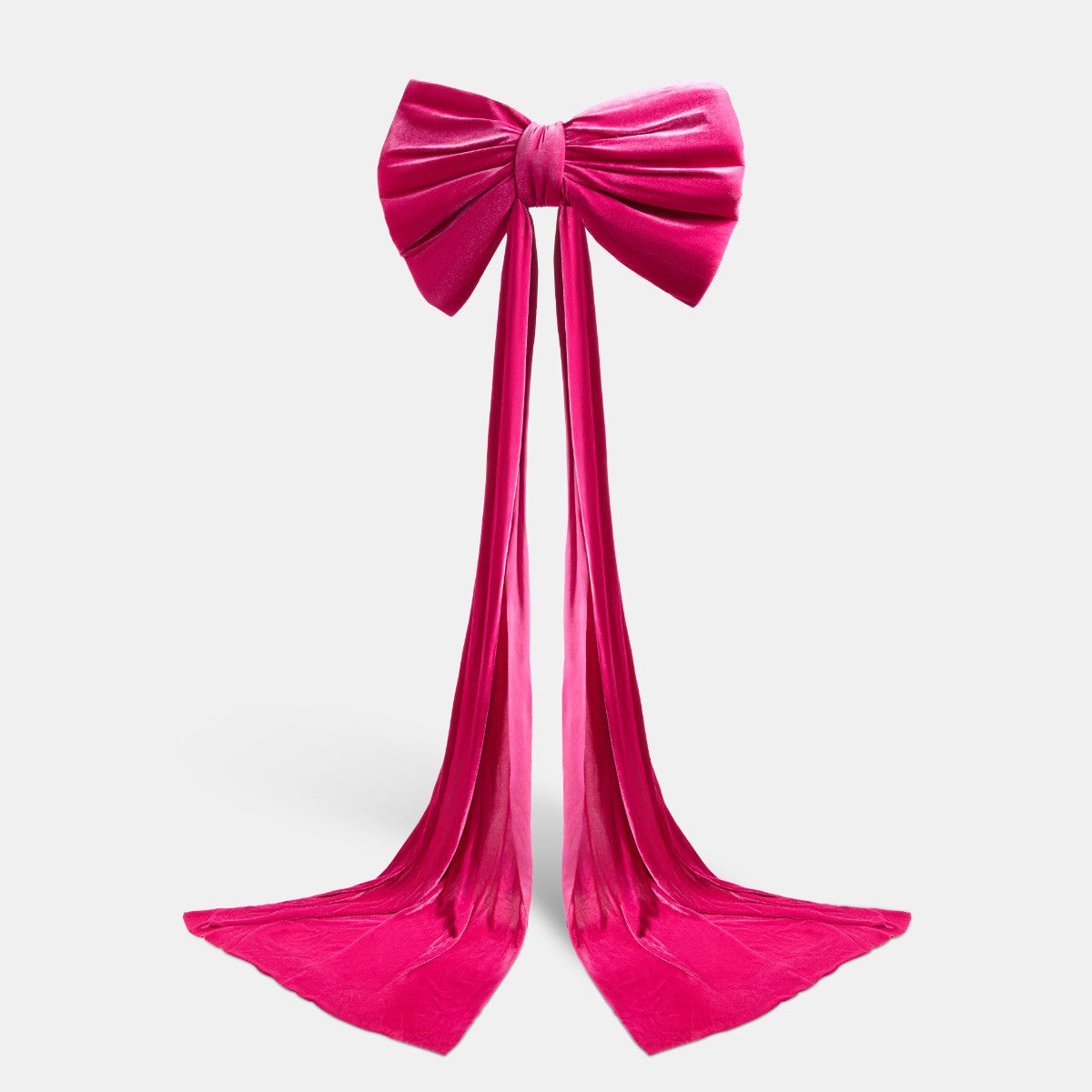 Hot pink velvet Christmas bow close-up - luxury texture Pinkmas detail